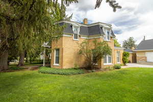 View of front of property with a front lawn