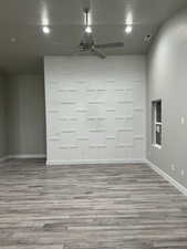 Spare room featuring ceiling fan and light hardwood / wood-style flooring