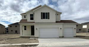 View of front property featuring a garage