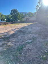 View of yard with a rural view and a mountain view