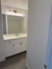 Bathroom with vanity and a textured ceiling