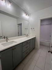 Bathroom featuring tile patterned floors and vanity