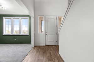 Foyer entrance with hardwood / wood-style flooring