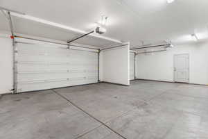 Garage featuring a garage door opener