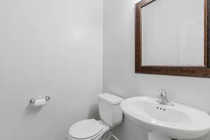 Bathroom featuring sink and toilet