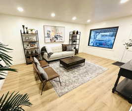 Living room with light hardwood / wood-style flooring