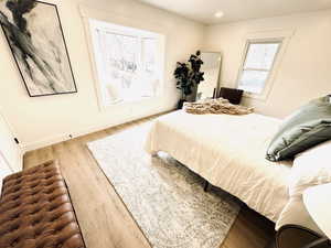 Bedroom with light hardwood / wood-style floors