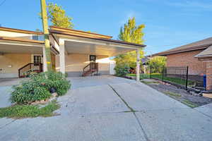 View of home's exterior with a carport