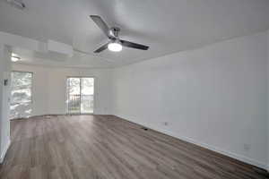 Spare room featuring hardwood / wood-style flooring, a textured ceiling, and ceiling fan