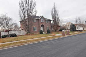 View of front of property with a front lawn