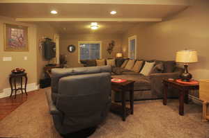 Living room featuring beamed ceiling and hardwood / wood-style flooring