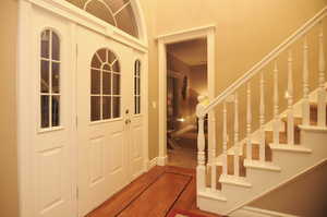 Foyer entrance featuring hardwood / wood-style flooring