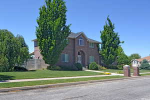 View of front of property featuring a front lawn