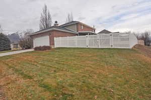 View of yard featuring a mountain view and a garage