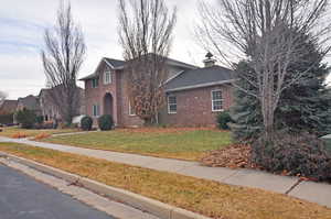 View of front of property with a front lawn