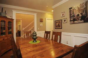 Dining area with crown molding