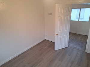 Unfurnished room with light wood-type flooring