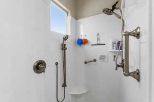 Primary Bathroom featuring walk in shower