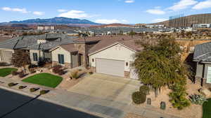 View of front facade featuring a mountain view and a garage