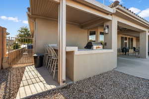 View of patio / terrace featuring area for grilling, a grill, and an outdoor bar