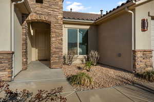 Entrance to property with a patio area