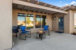 View of patio featuring an outdoor fire pit and a pergola