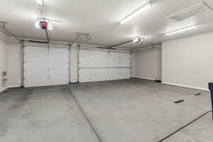 Garage featuring a garage door opener