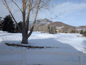 Property view of mountains and golf course