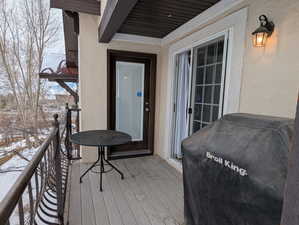 Snow covered deck with grilling area
