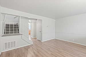 Empty room featuring light hardwood / wood-style floors