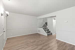 Empty room featuring wood-type flooring