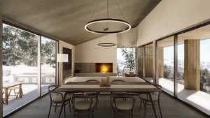 Sunroom / solarium featuring lofted ceiling, a mountain view, and a wealth of natural light