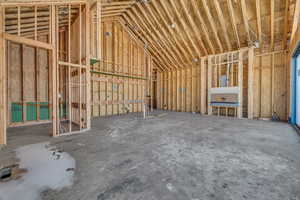 Miscellaneous room with lofted ceiling