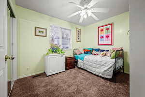 Bedroom featuring carpet floors and ceiling fan