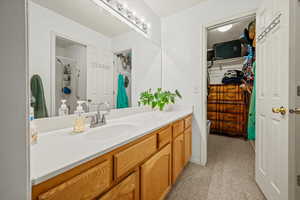 Bathroom with walk in shower and vanity