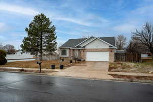 View of front of property featuring a garage