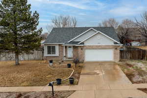 View of front of property featuring a garage