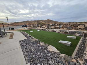 View of yard featuring a mountain view and a patio