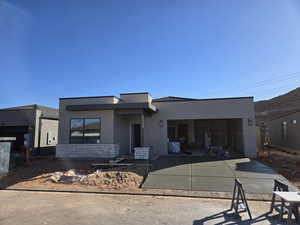 View of front of house with a patio area