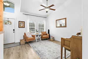 Formal living area with vaulted ceiling, ceiling fan