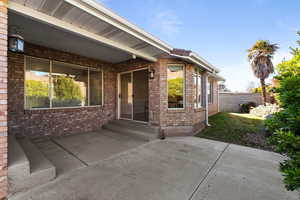 Doorway to property with a patio