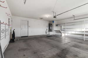 Garage with a garage door opener and water heater