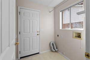 Laundry room featuring gas dryer hookup, hookup for a washing machine, and electric dryer hookup