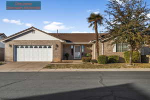 Single story home featuring a garage