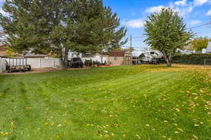 View of yard with a storage shed