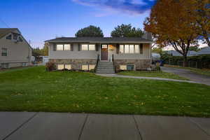 Split foyer home with a lawn