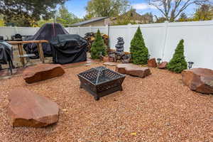 View of yard with a fire pit