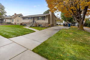 View of front of property with a front yard