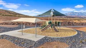 View of jungle gym with a mountain view