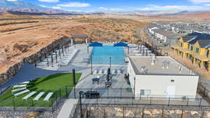 Birds eye view of property with a mountain view